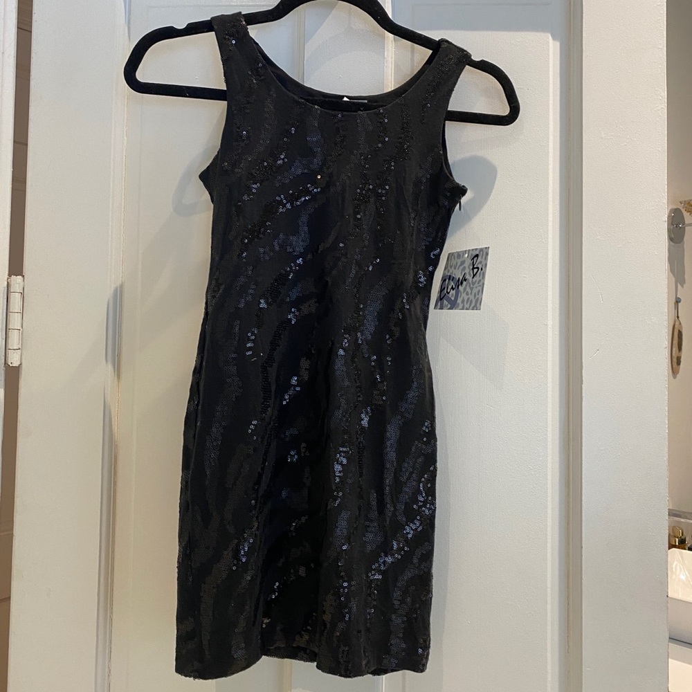 Children’s black sequined dress.
